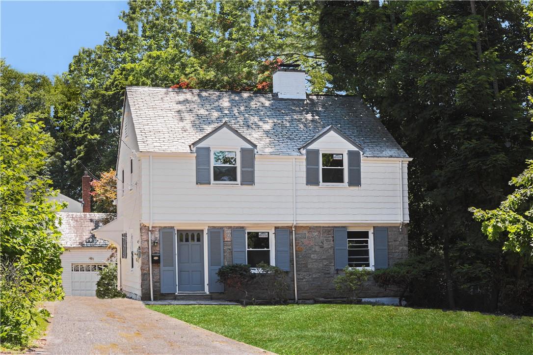 152 Boulevard Scarsdale, NY 10583 - Photo 1 of 1 a front view of a house with garden