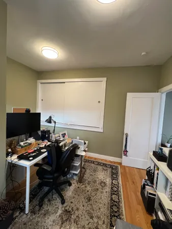 a workspace with furniture and screen