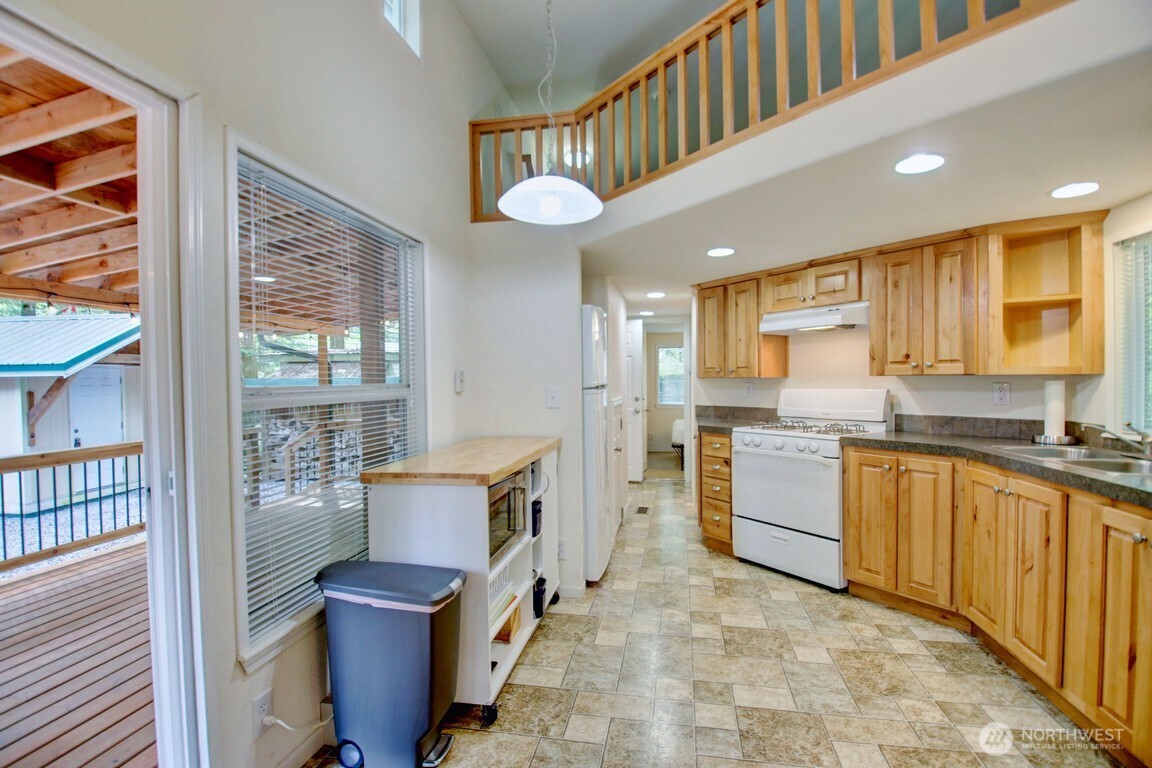 20 Goldrush Road Deming, WA 98244 - Photo 6 of 40 a kitchen with stainless steel appliances granite countertop a stove and cabinets