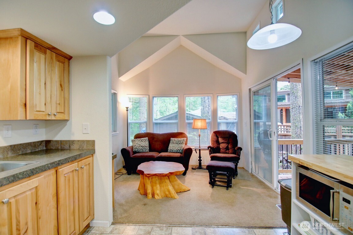 20 Goldrush Road Deming, WA 98244 - Photo 8 of 40 a living room with furniture and a fireplace
