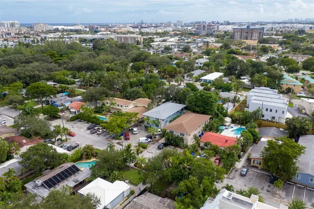 an aerial view of residential houses with outdoor space