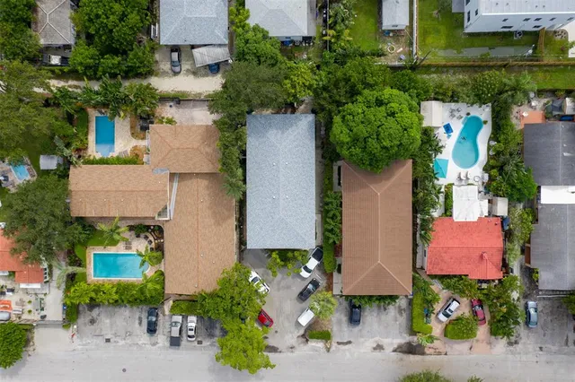 an aerial view of houses with yard