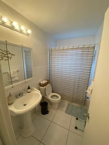a bathroom with a sink and toilet