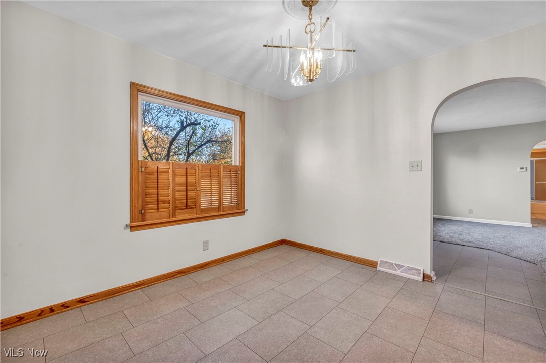 503 Churchill Road Youngstown, OH 44505 - Photo 3 of 32 Dining Room room with arched walkways and a chandelier