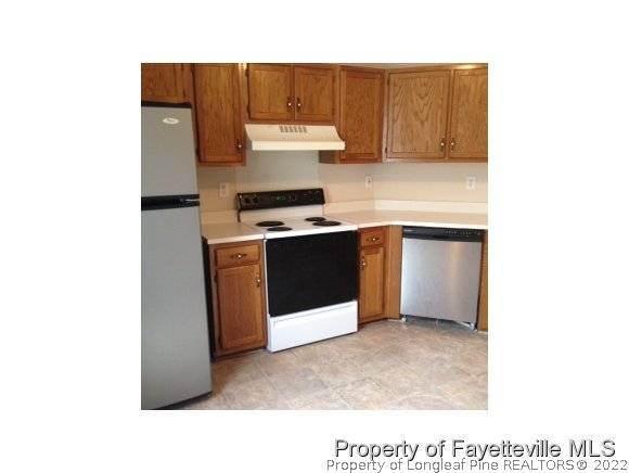 235 Sawyer Road Cameron, NC 28326 - Photo 2 of 3 a kitchen with a stove and a microwave