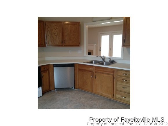 235 Sawyer Road Cameron, NC 28326 - Photo 3 of 3 a kitchen with a sink and cabinets