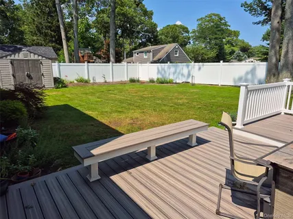 a view of a backyard with sitting area