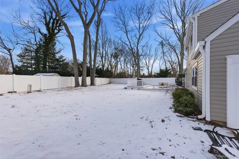 a view of a backyard with sitting area