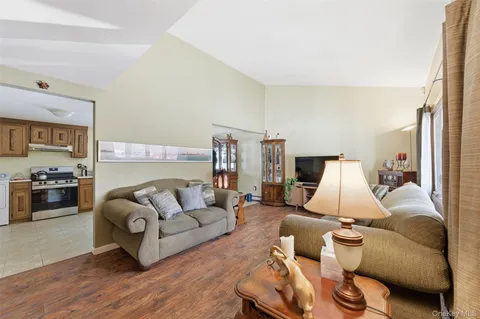 a living room with furniture or couch and a flat screen tv