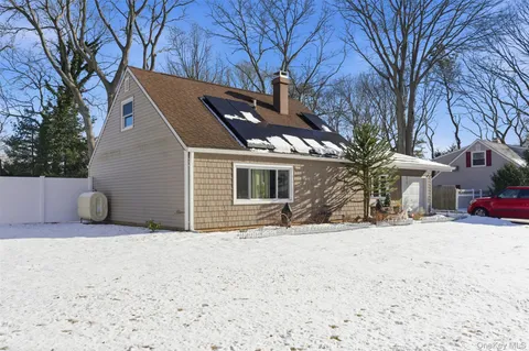 a view of a house with snow in the yard
