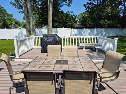 a view of a deck with furniture