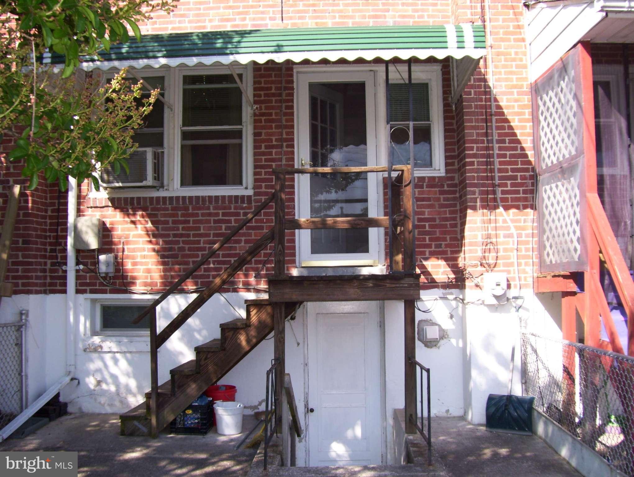 74 Wiltshire Road Baltimore, MD 21221 - Photo 10 of 11 a front view of a house with stairs