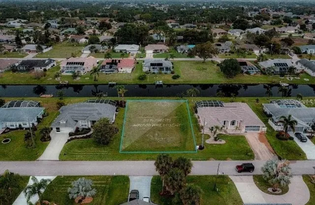 an aerial view of residential house with outdoor space