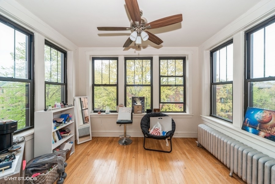 403 South Kenilworth Avenue, Unit 2 Oak Park, IL 60302 - Photo 2 of 7 a living room with furniture and a large window with wooden floor