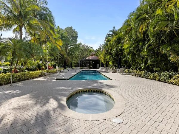 a view of a backyard with swimming pool