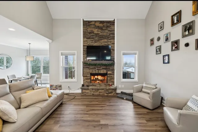 a view of a dining room with furniture wooden floor and chandelier