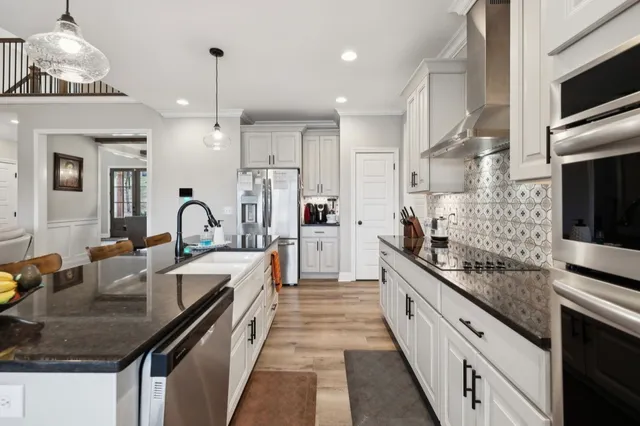 a bathroom with a shower and a glass door