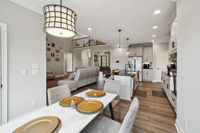 a bedroom with a bed and a ceiling fan