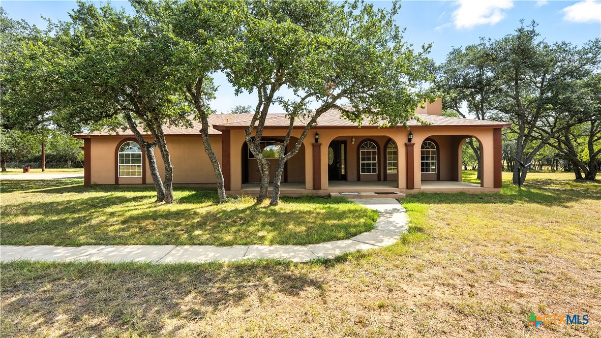 220 Lanier Ranch Road Driftwood, TX 78619 - Photo 2 of 48 front view of a house with a yard