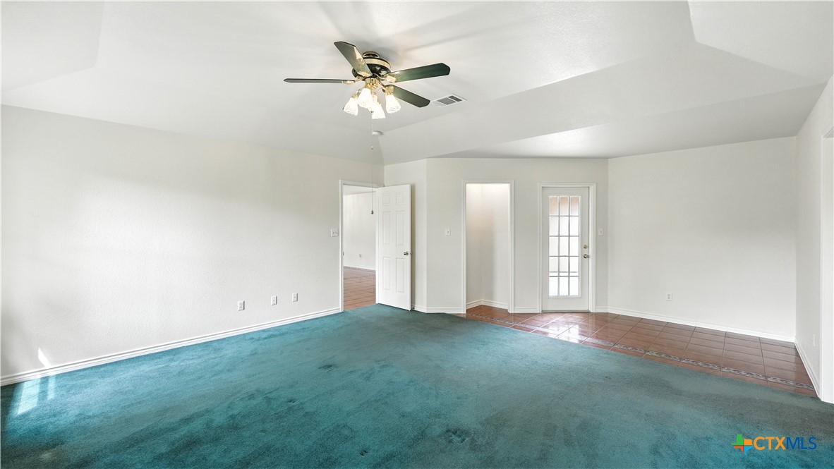 220 Lanier Ranch Road Driftwood, TX 78619 - Photo 21 of 48 wooden floor in an empty room with a window