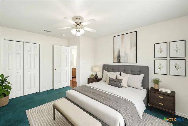 a bedroom with a bed and a window