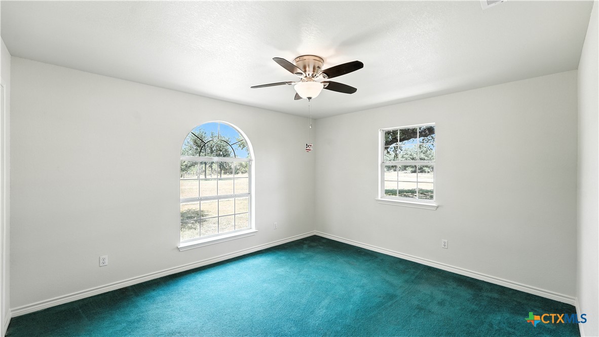 220 Lanier Ranch Road Driftwood, TX 78619 - Photo 26 of 48 a view of an empty room with a window