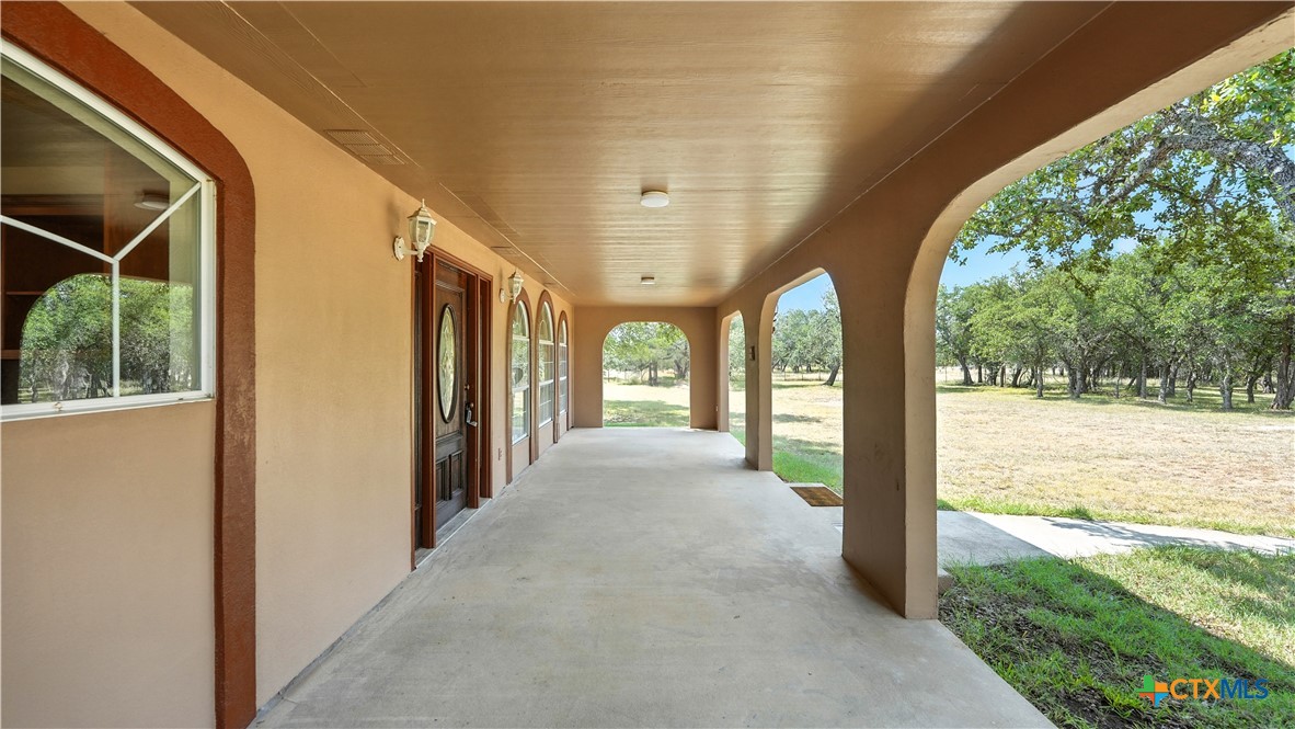 220 Lanier Ranch Road Driftwood, TX 78619 - Photo 31 of 48 a view of a porch with a big yard