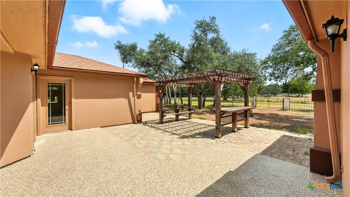 220 Lanier Ranch Road Driftwood, TX 78619 - Photo 34 of 48 a view of a backyard with a slide