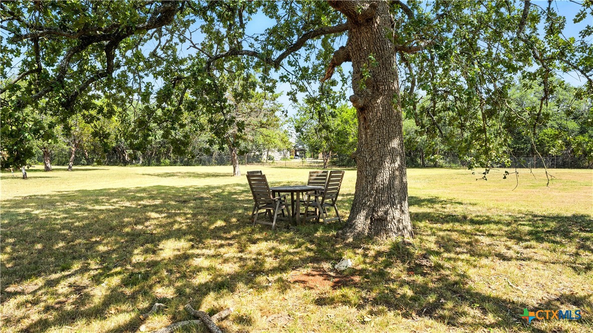 220 Lanier Ranch Road Driftwood, TX 78619 - Photo 35 of 48 a backyard of a house with a yard