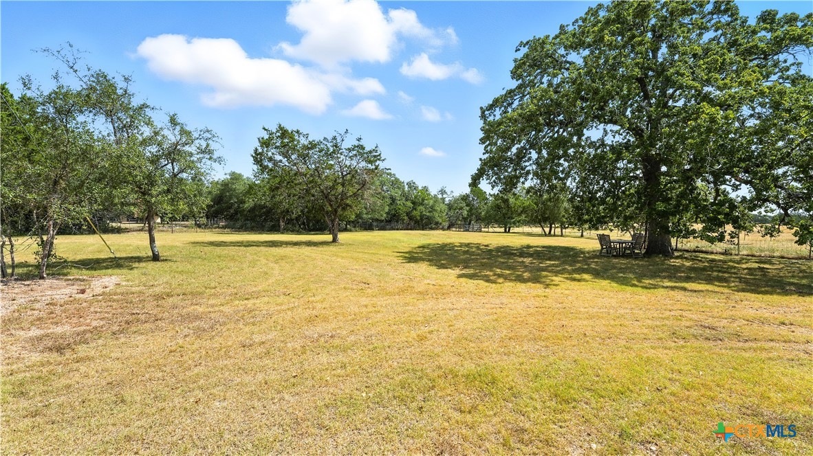 220 Lanier Ranch Road Driftwood, TX 78619 - Photo 36 of 48 a view of a swimming pool with an outdoor space and seating area