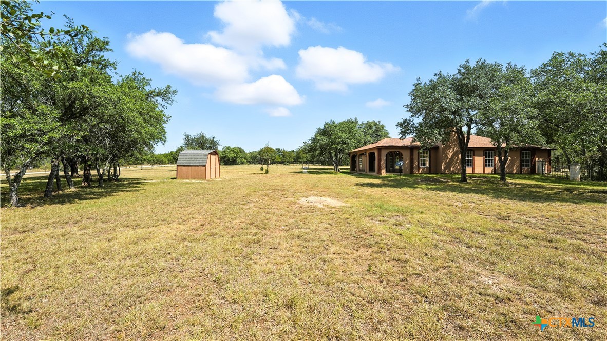 220 Lanier Ranch Road Driftwood, TX 78619 - Photo 41 of 48 a view of a swimming pool with an outdoor space
