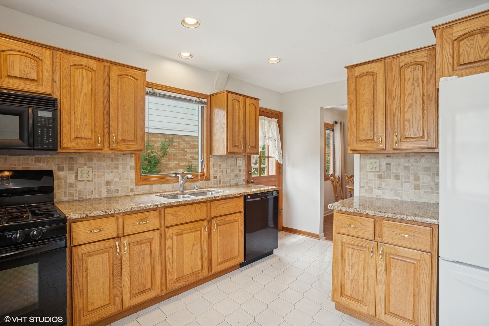 43 N Mount Des Plaines, IL 60016 - Photo 7 of 25 a kitchen with stainless steel appliances granite countertop a stove a sink and a refrigerator