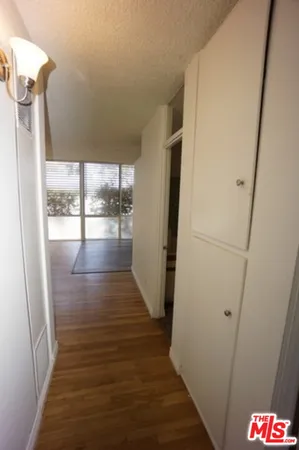 a view of hallway and wooden floor