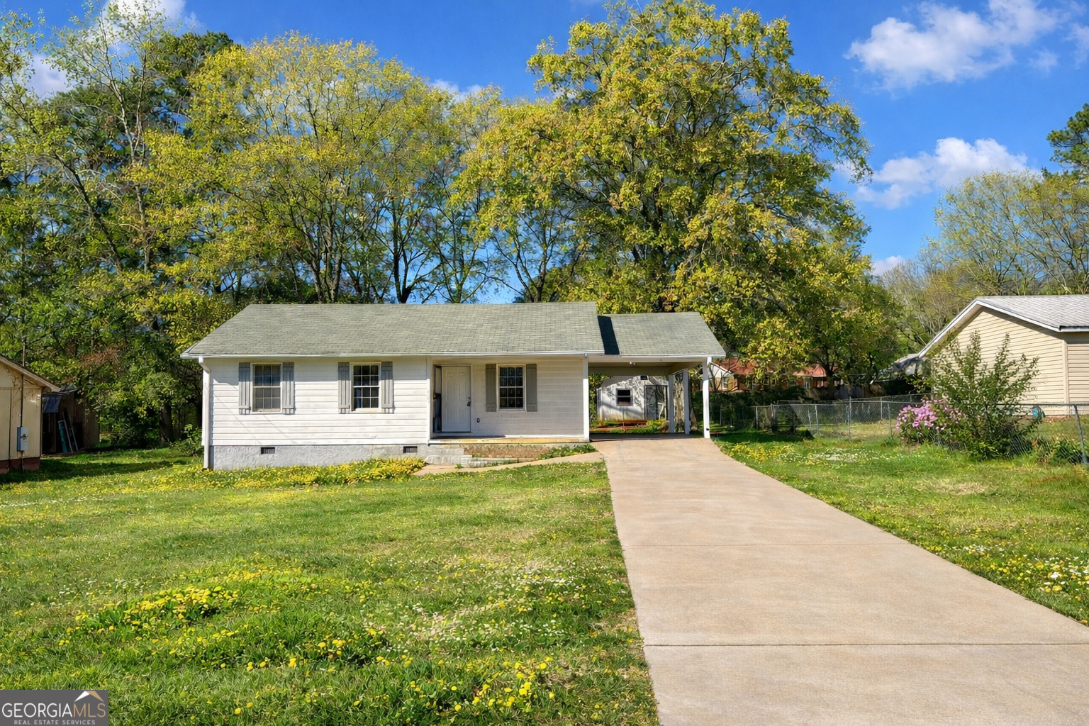 a front view of a house with yard