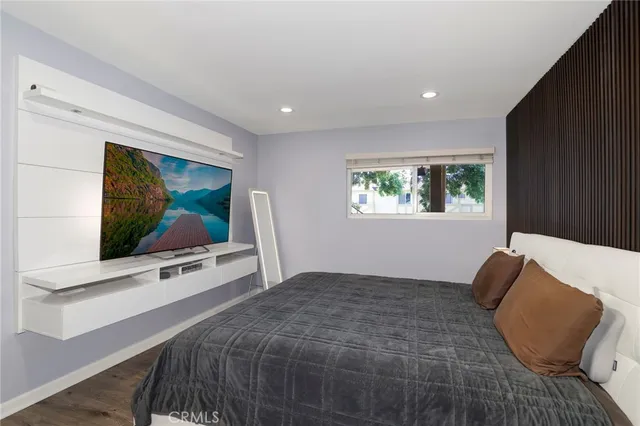 a bedroom with bed and window