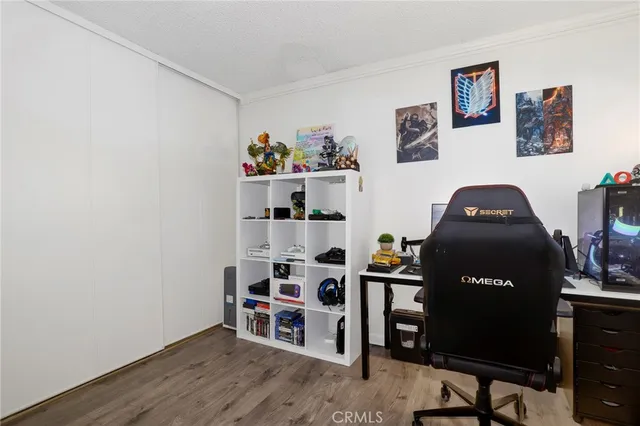 a bedroom with a workspace