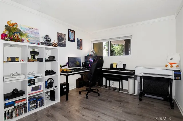 a view of a workspace with furniture and bedroom