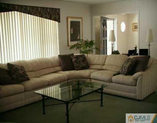 33 South Cliff Road Colonia, NJ 07067 - Photo 5 of 7 a living room with furniture and a large window