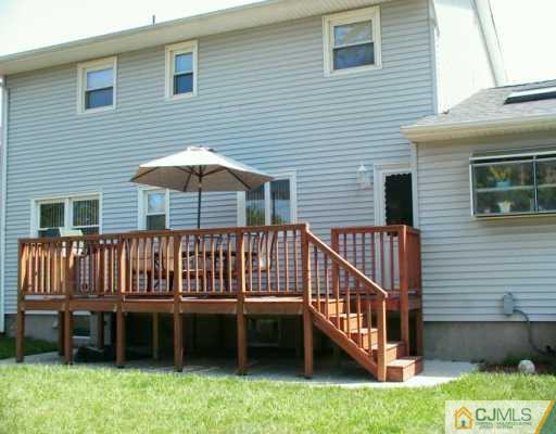 33 South Cliff Road Colonia, NJ 07067 - Photo 6 of 7 a view of backyard with deck and barbeque grill