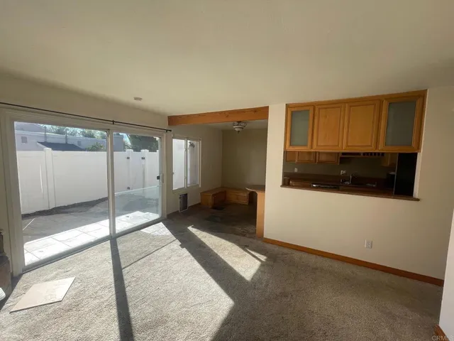 a view of a hallway with a livingroom