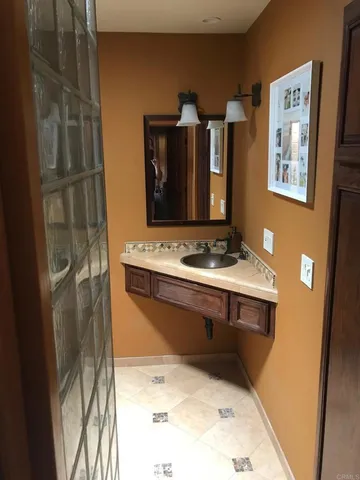a bathroom with sink and mirror