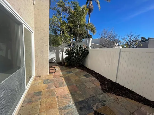 a view of a pathway both side of house
