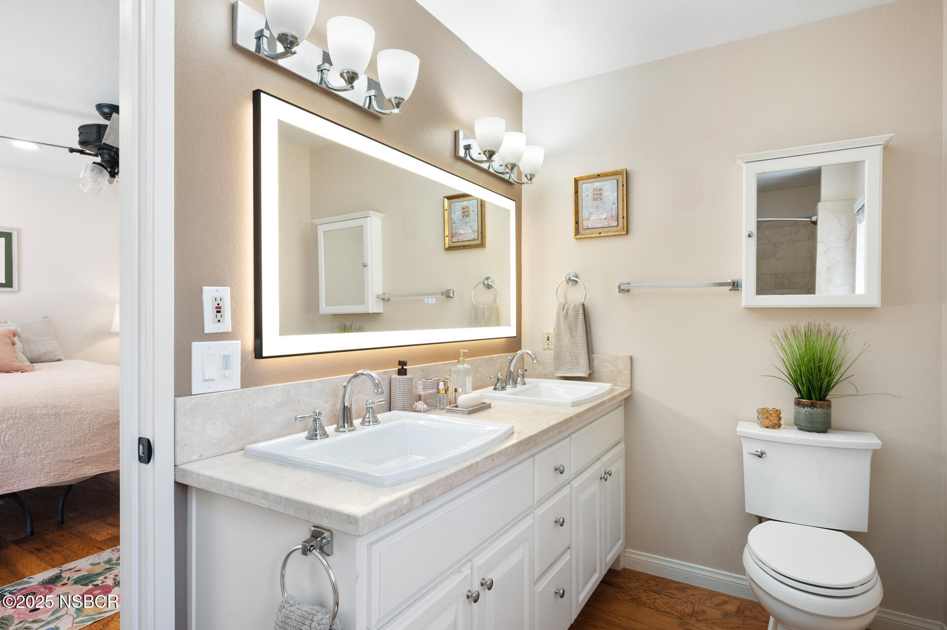 1011 North Refugio Road Santa Ynez, CA 93463 - Photo 18 of 48 a bathroom with a granite countertop toilet sink and mirror
