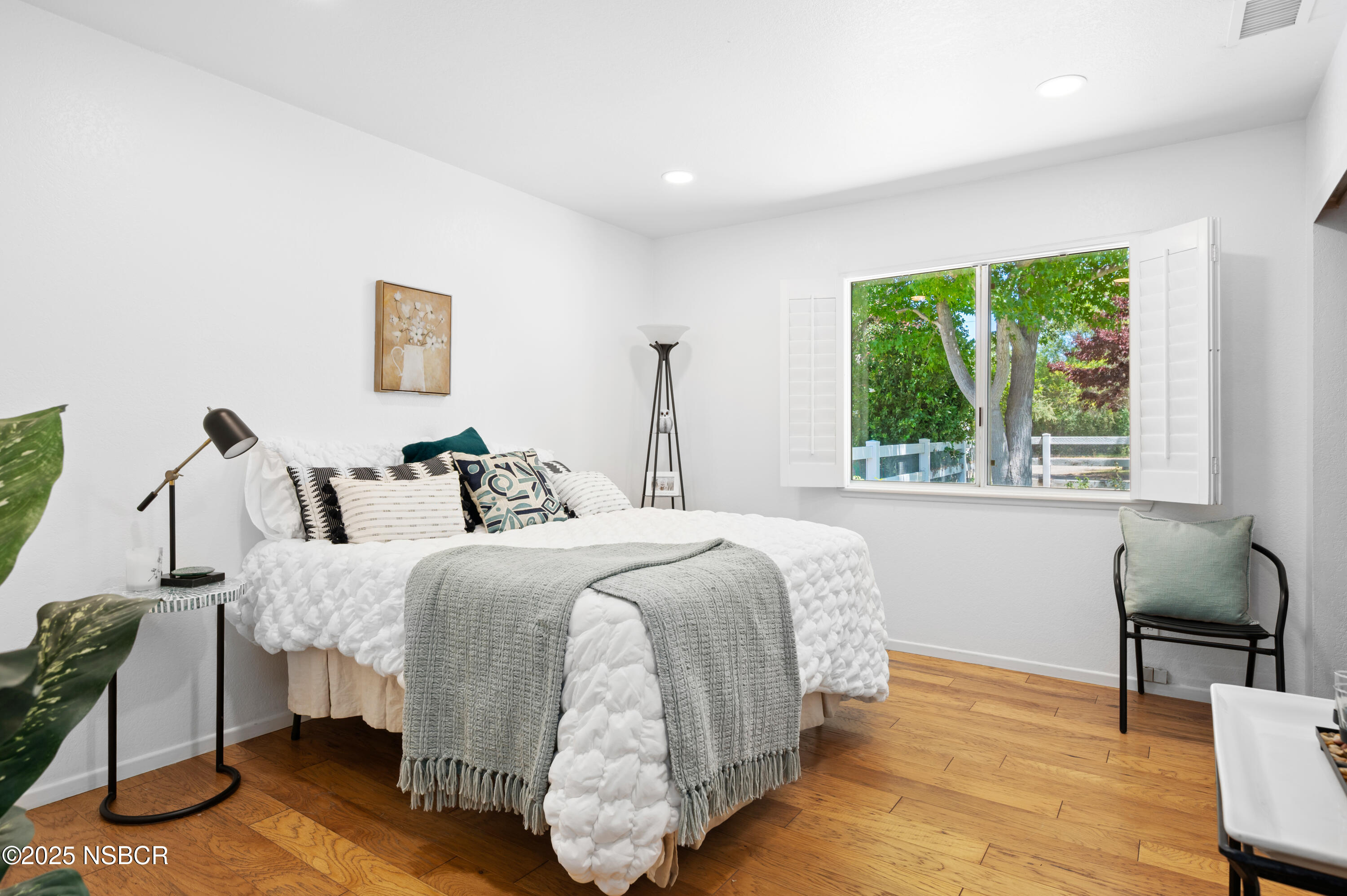 1011 North Refugio Road Santa Ynez, CA 93463 - Photo 19 of 48 a bed room with a bed and a chair