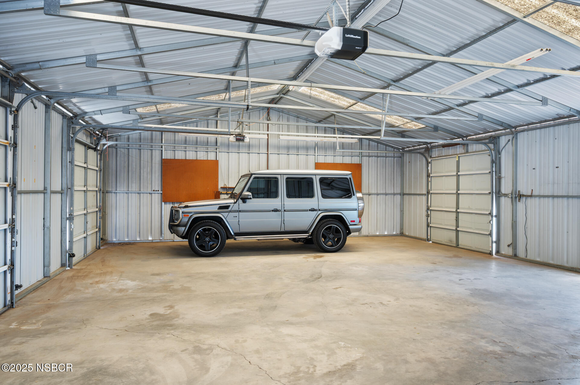 1011 North Refugio Road Santa Ynez, CA 93463 - Photo 27 of 48 a view of a garage with car parked