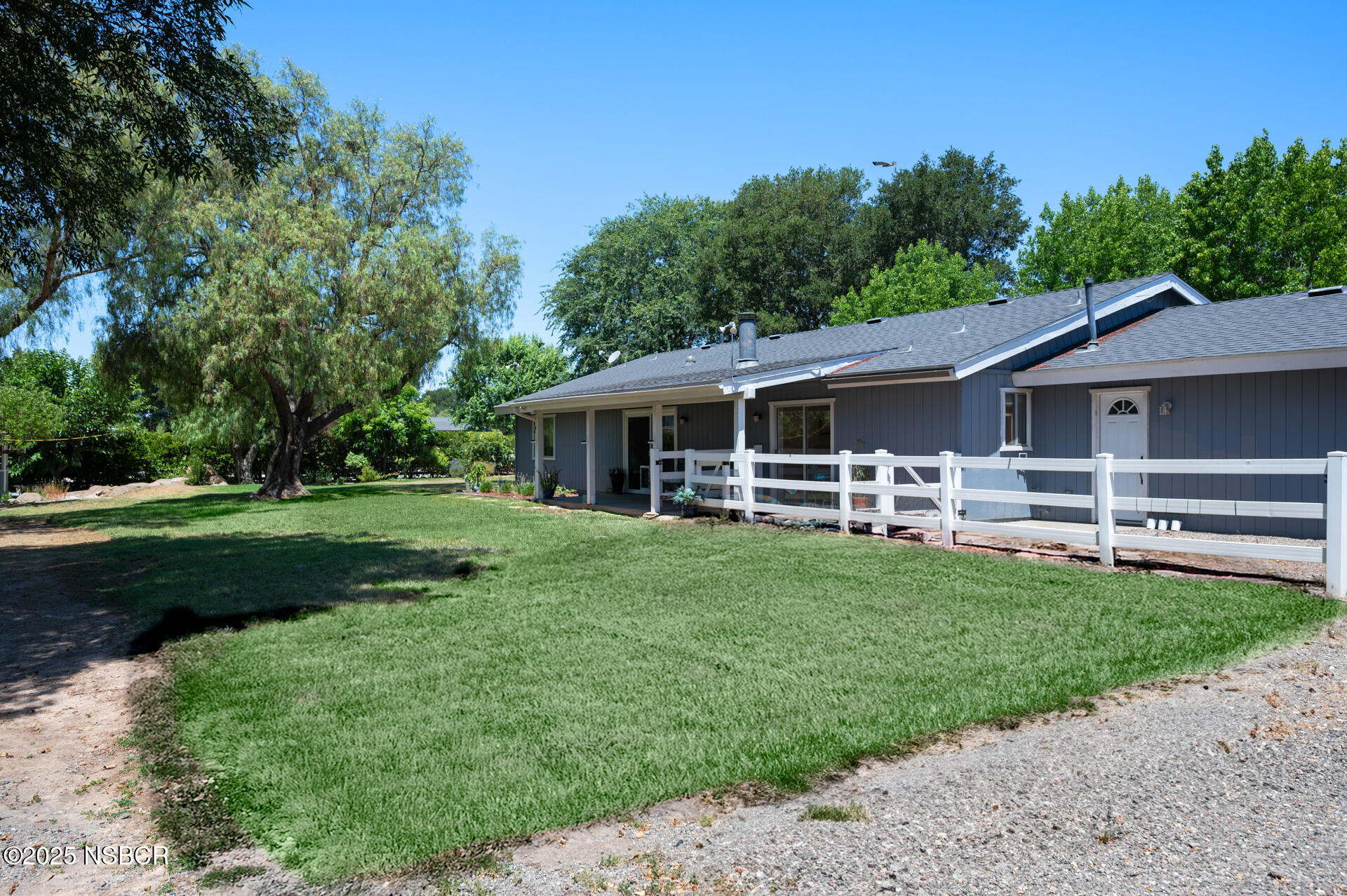 1011 North Refugio Road Santa Ynez, CA 93463 - Photo 31 of 48 a front view of a house with a garden