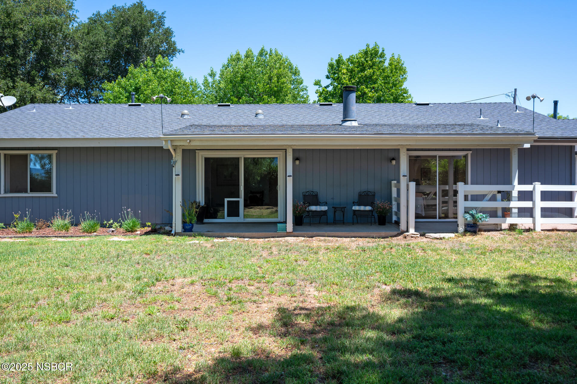 1011 North Refugio Road Santa Ynez, CA 93463 - Photo 32 of 48 a backyard of a house with yard and outdoor seating