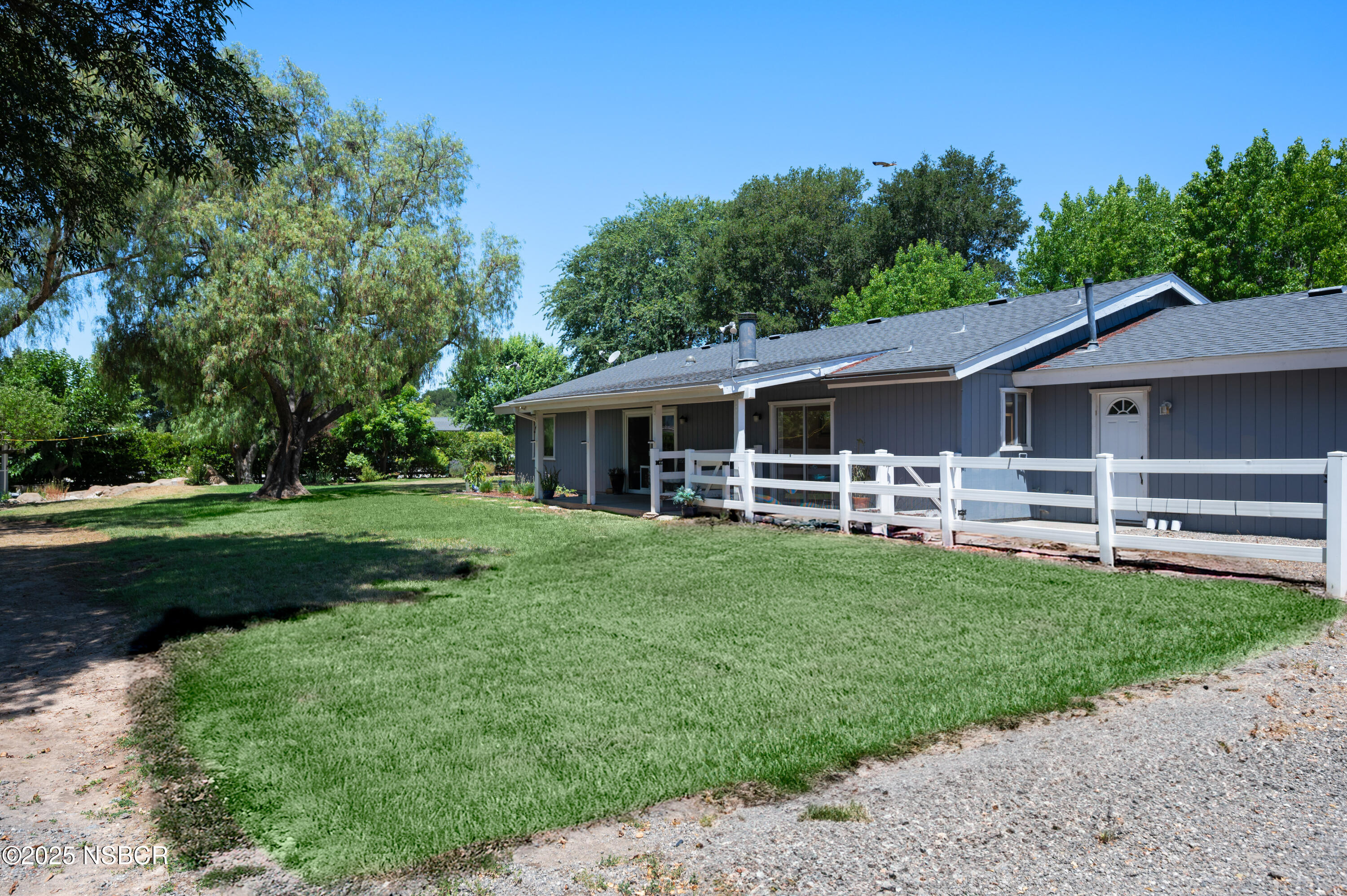 1011 North Refugio Road Santa Ynez, CA 93463 - Photo 33 of 48 a front view of a house with a garden