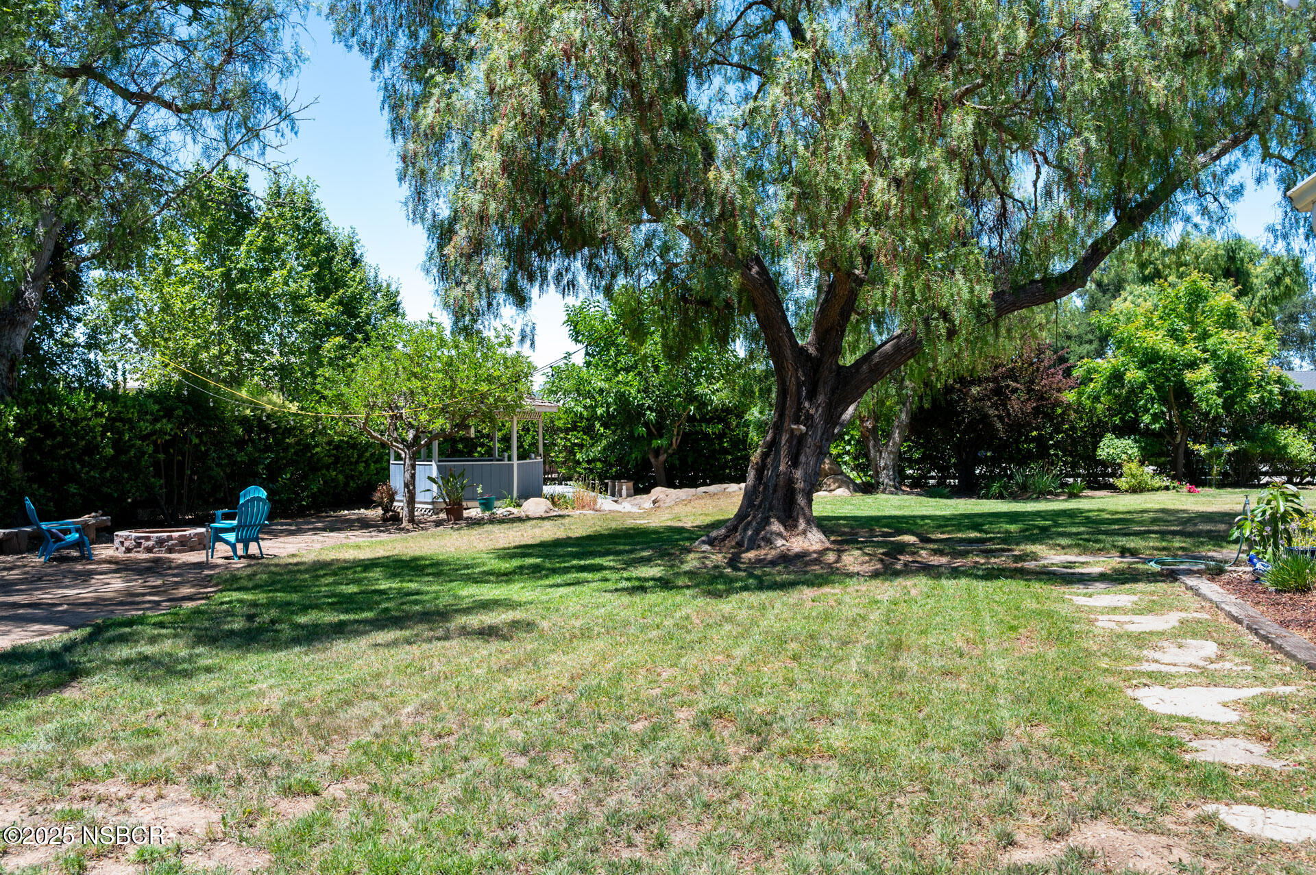 1011 North Refugio Road Santa Ynez, CA 93463 - Photo 37 of 48 a view of a backyard with a tree