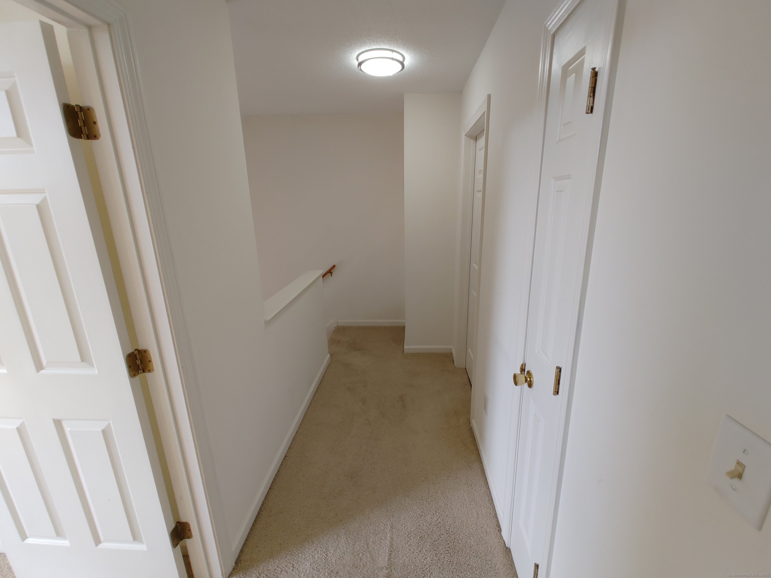 402 Whetstone Mills, Unit 402 Dayville, CT 06241 - Photo 13 of 21 a view of a hallway